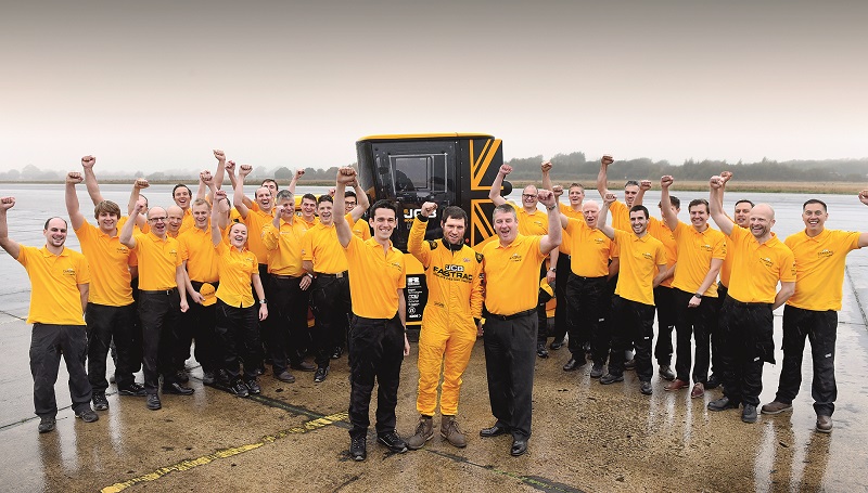The team celebrates landing the World's Fastest Tractor record. In the foreground are l-r Alex Skittery, Guy Martin and JCB Chief Innovation and Growth Officer Tim Burnhope .jpg